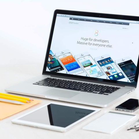 Apple Devices On A Desk Presenting Ios 8